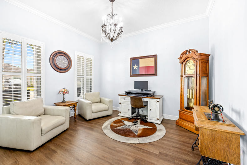 Home office and study with warm wood tones in a South Florida listing